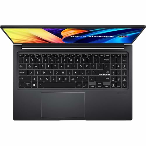 Top view of an ASUS Vivobook laptop with open screen and visible keyboard.