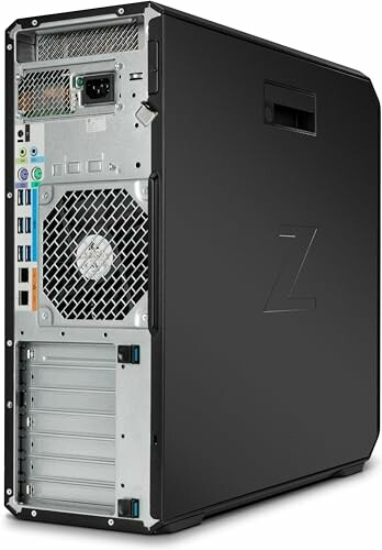 Back view of a desktop computer tower showing ports and fan.