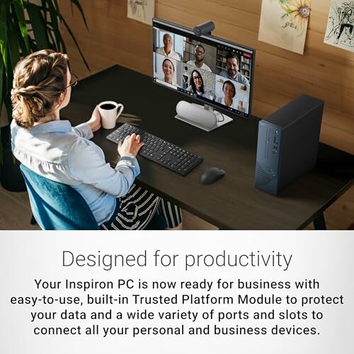 Woman in video conference at desk with PC and coffee.